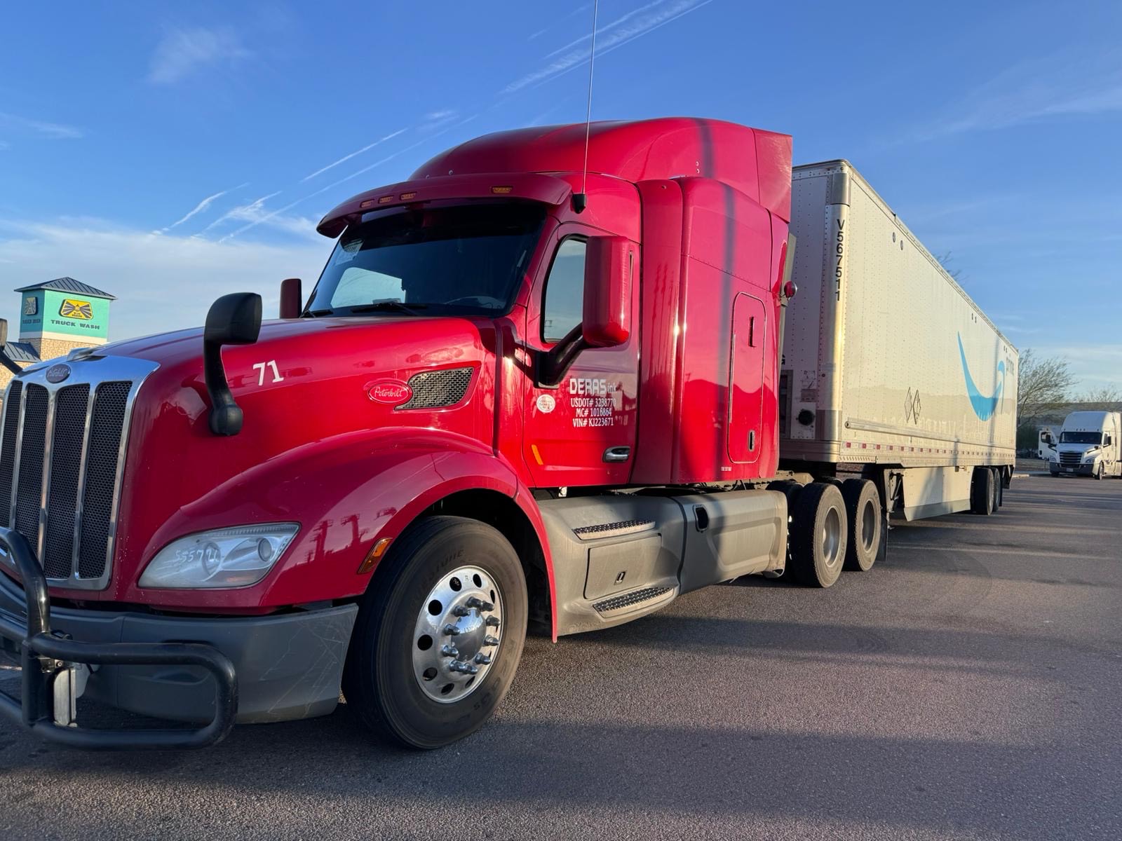 Red Deras Trucking semi-truck with a trailer